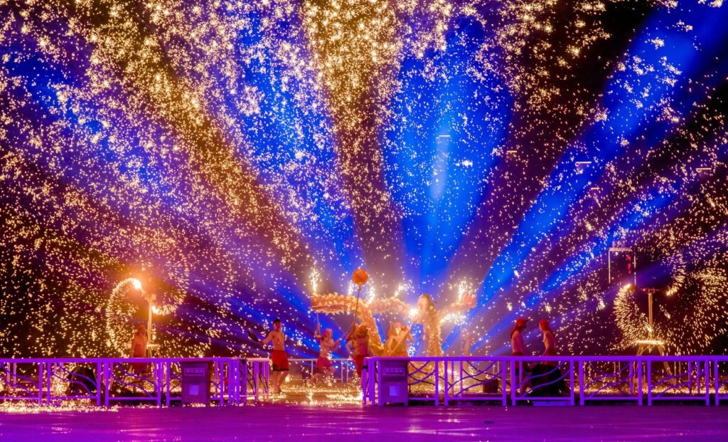 Vibrant festival performance with sparks and lights in Changzhou, China.