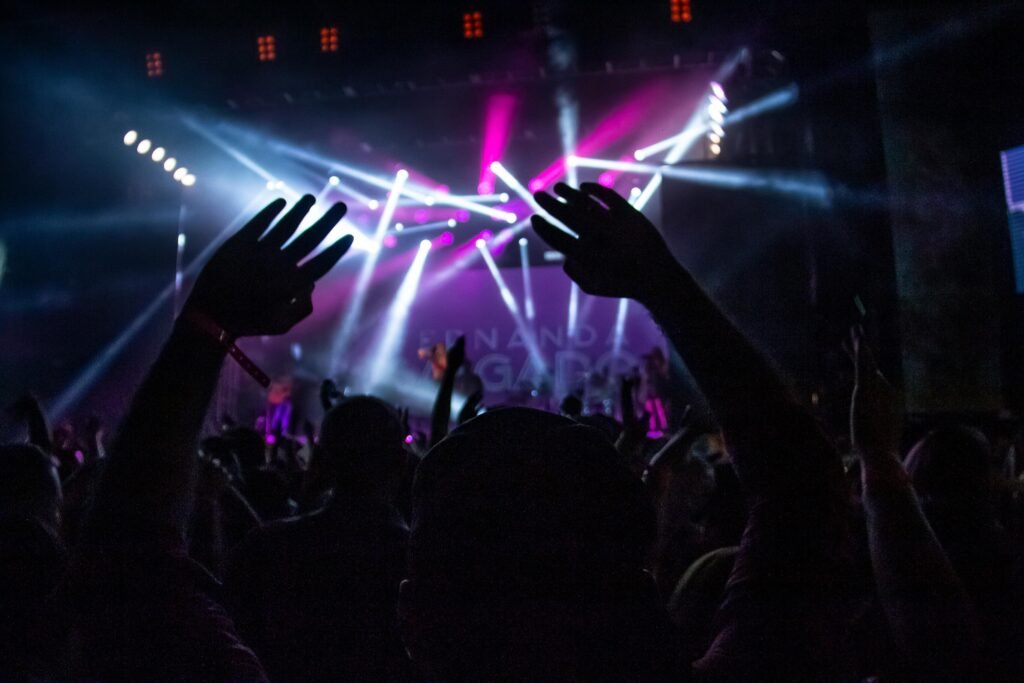 A vibrant night concert scene with a lively crowd enjoying the show in São Paulo, Brazil.