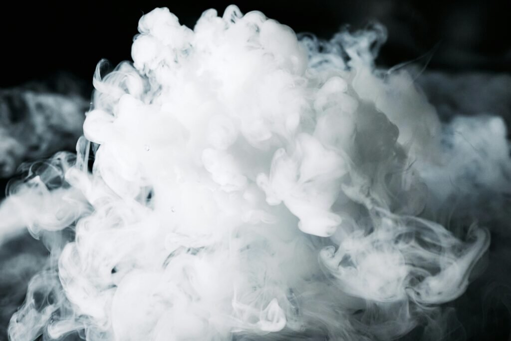 A dense, artistic smoke cloud captured with dramatic lighting, creating a mysterious effect.